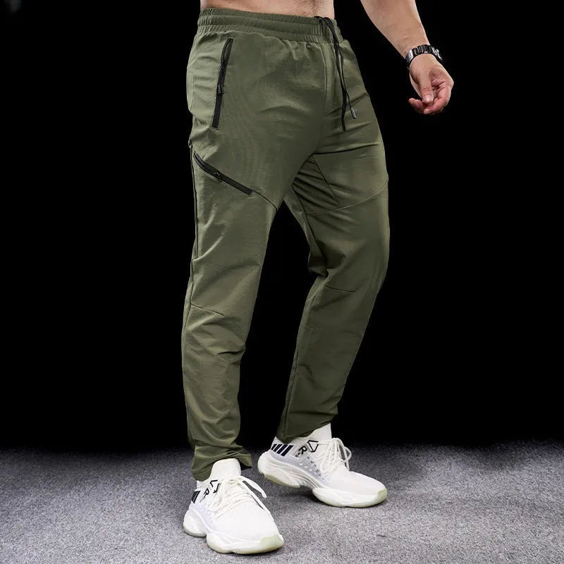 Men's waterproof quick-dry workout trousers in nylon fabric for sports and fitness