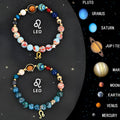 Set of two natural stone beaded bracelets representing zodiac signs on a neutral background.