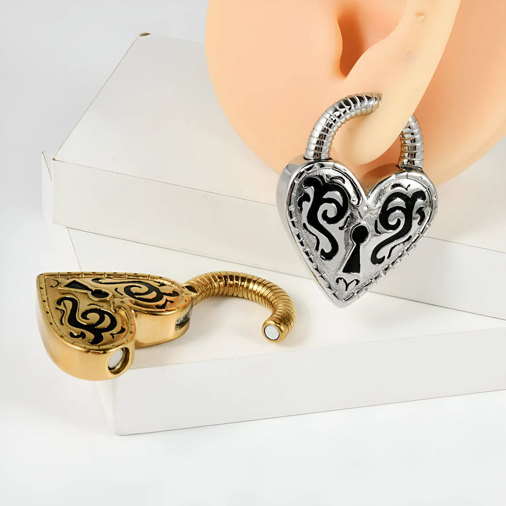 A pair of women's heart-shaped stainless steel earrings in a gold colour finish.