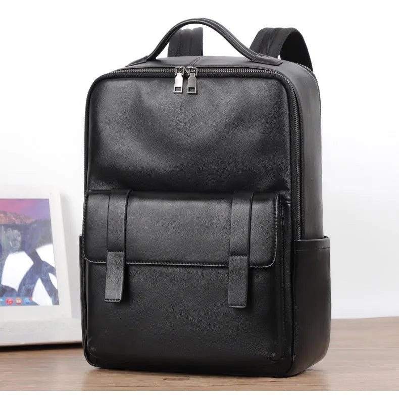 Men's black genuine leather computer backpack with 36-55L capacity and physiological curve back plate