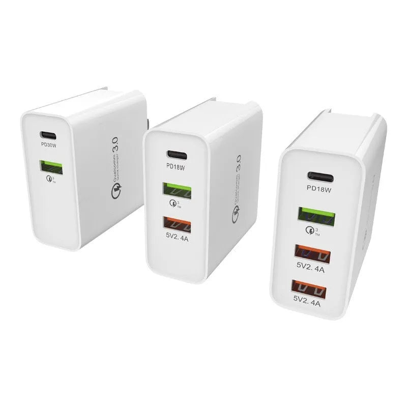 White 4-port fast charger with PD and QC technology showing UK plug