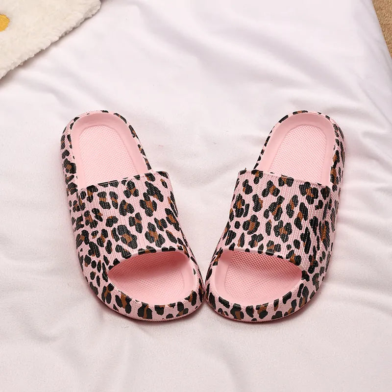 Women's leopard print EVA slippers with a thick sole on a plain background.