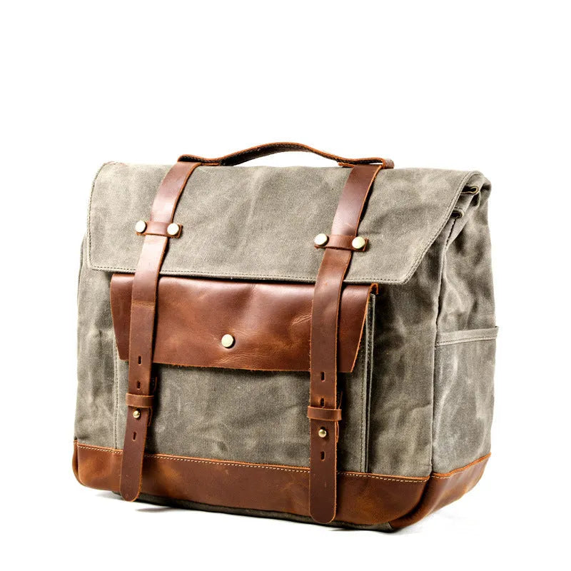 Cotton retro-style messenger bag showing internal organiser pockets and rivet detailing.