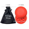 Orange-red golf training mat with weighted centre for swing practice