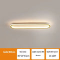 Black minimalist strip ceiling lamp mounted flush on a white ceiling.