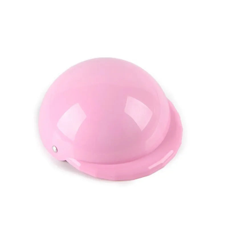 Solid colour plastic dog motorcycle helmet cap in Japanese South Korea style on a pink background.