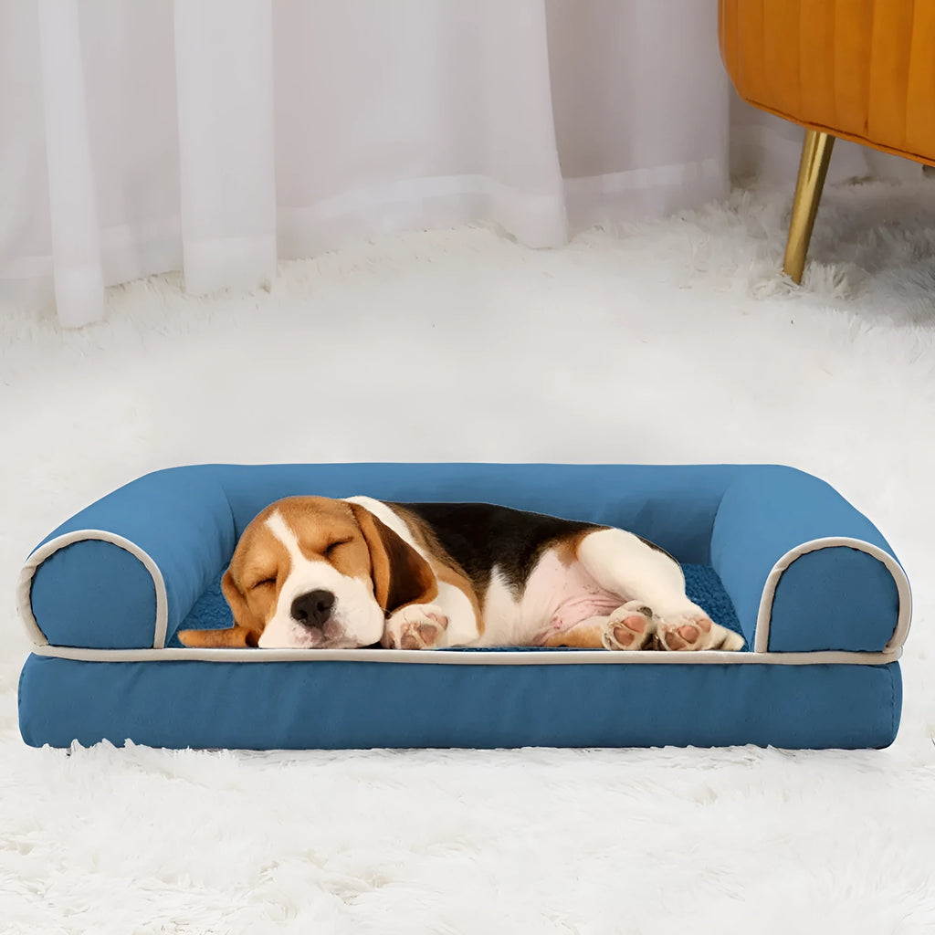 Square-shaped dog bed with sponge cushion, shown in a neutral colour like light grey or beige.
