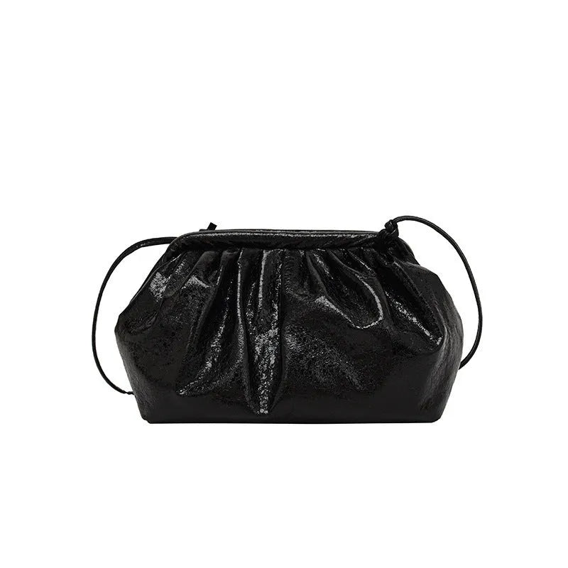 Simple hair clip fastening crossbody bag in shell shape, shown in rose red colour.