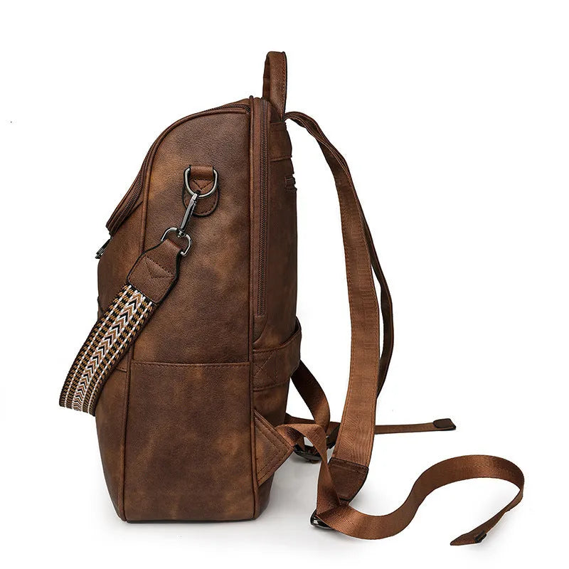 Retro college backpack with curved shoulder straps in multiple colour options including black, blue, grey, and coffee tones