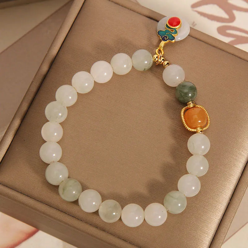 Women's ice jade and pearl bracelet with a retro-styled peace jade buckle.
