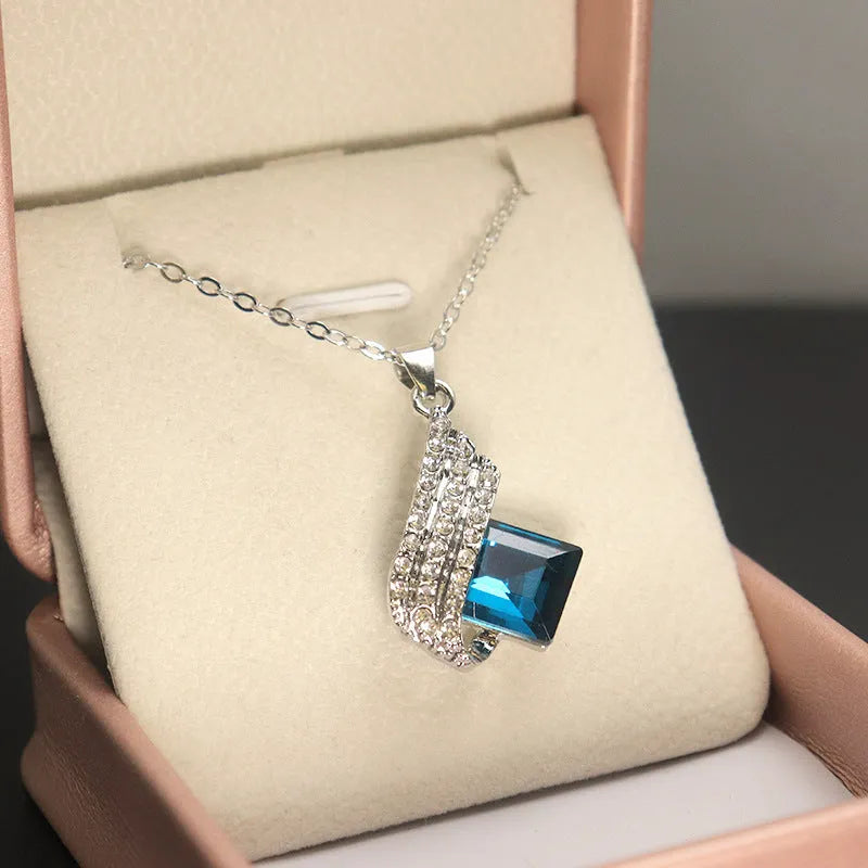 Alloy and glass necklace and earring set with cross chain design and electroplated finish