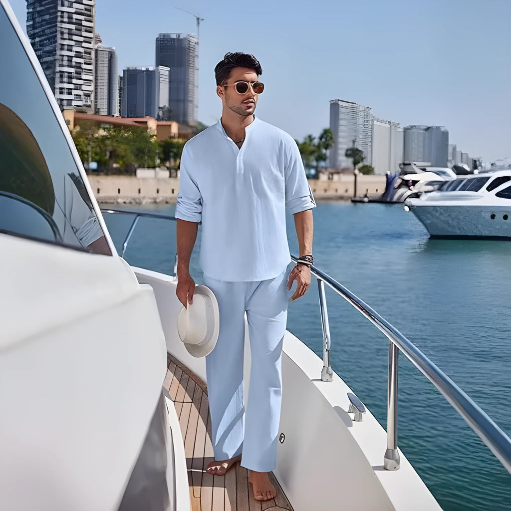 Men's casual cotton suit set in a solid colour, featuring a long-sleeved top and matching trousers.