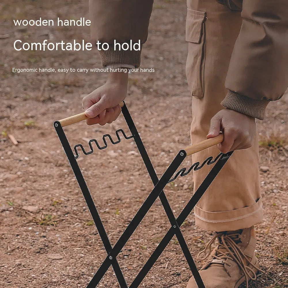 Black folding iron outdoor trash rack with a wooden handle standing upright.