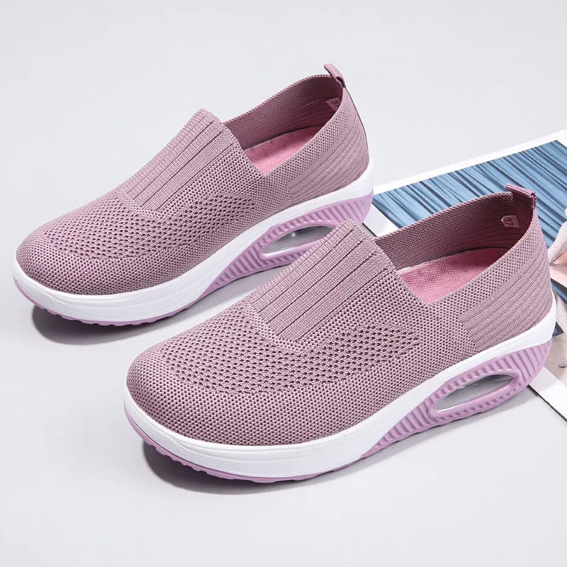 Women's mesh running shoes in beige with round toe and air cushion midsole.