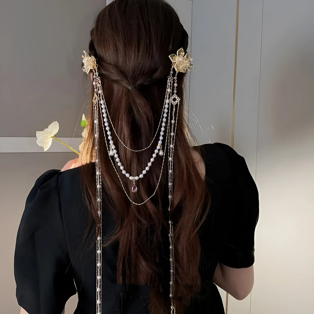 Gold women's hairpin with a pearl diamond flower and a long tassel.