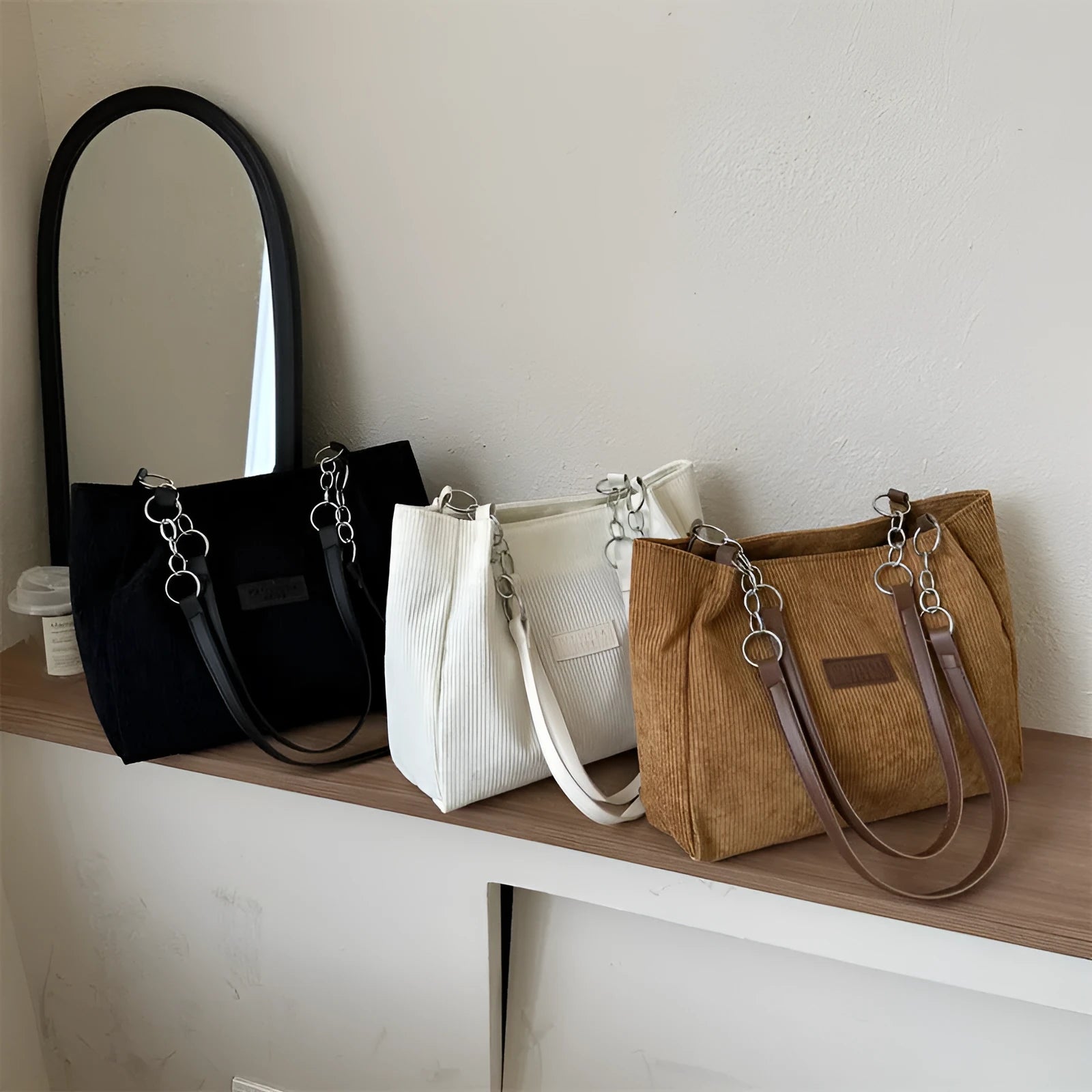 Corduroy one-shoulder tote handbag in a horizontal square shape, shown in brown colour.