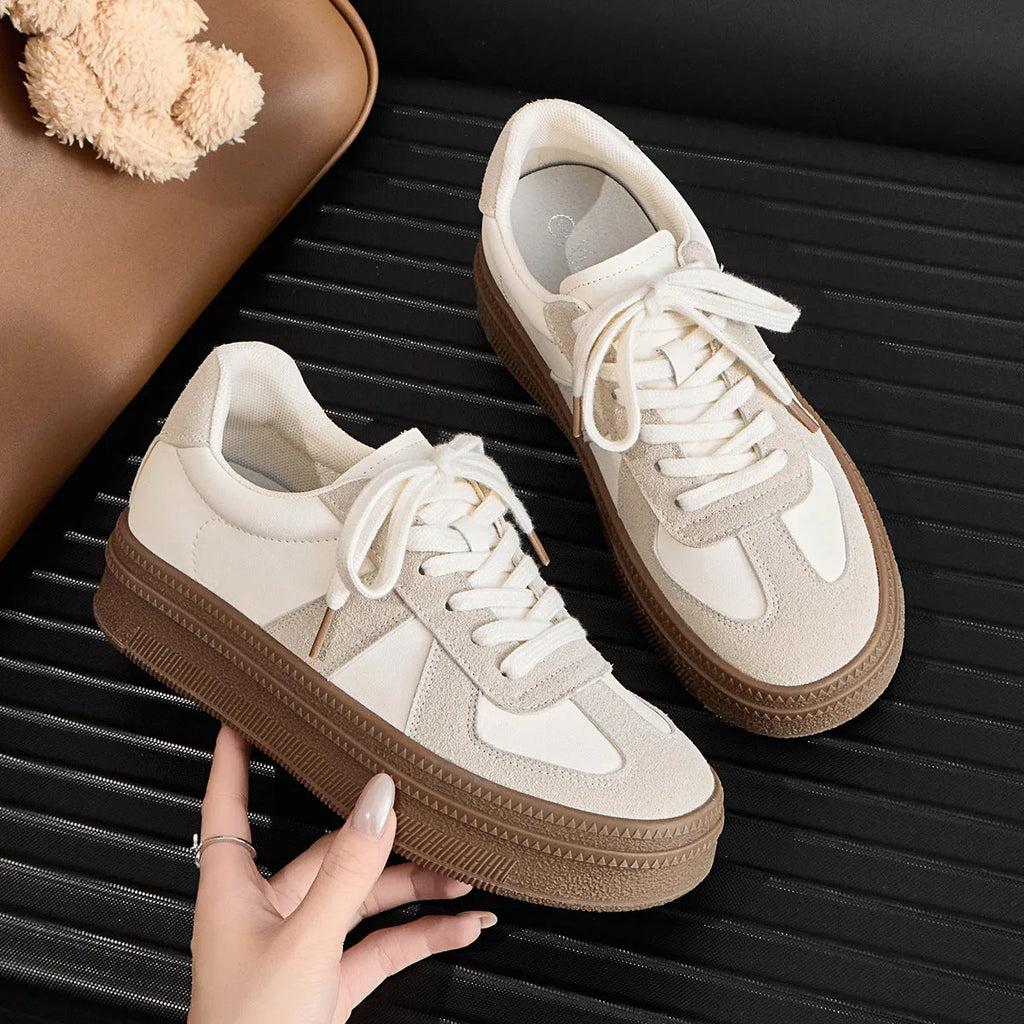 Women's retro casual board shoes with round toe, cross strap, and lace-up front in matte finish.