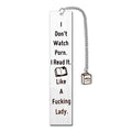 Stainless steel tassel-style bookmark with engraved 'reading enthusiasts literary' text on a metal surface.