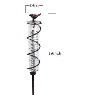 Cast iron bird rain gauge with glass measurement tube showing 1-20 scale for garden rainfall monitoring