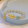 Niche Girlfriends Ice Crack Floral glazed bracelet with red, pink, and white glass beads and a zodiac charm.