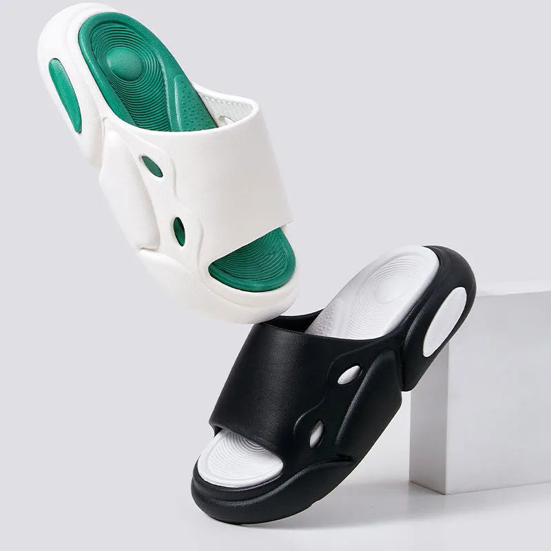 Two-colour thick-soled EVA slippers for couples on a floor, showing pink and purple or black and white colour options.