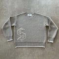 Grey loose-fitting jacquard knit pullover coat with long sleeves on a hanger.