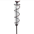 Cast iron bird rain gauge with glass measurement tube showing 1-20 scale for garden rainfall monitoring