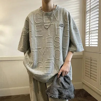 Men's grey t-shirt with three-dimensional raised letter pattern, short sleeves, loose retro fit