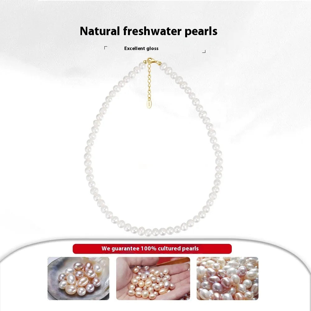 Close-up of a women's adjustable necklace with a round natural freshwater pearl on a silver chain.