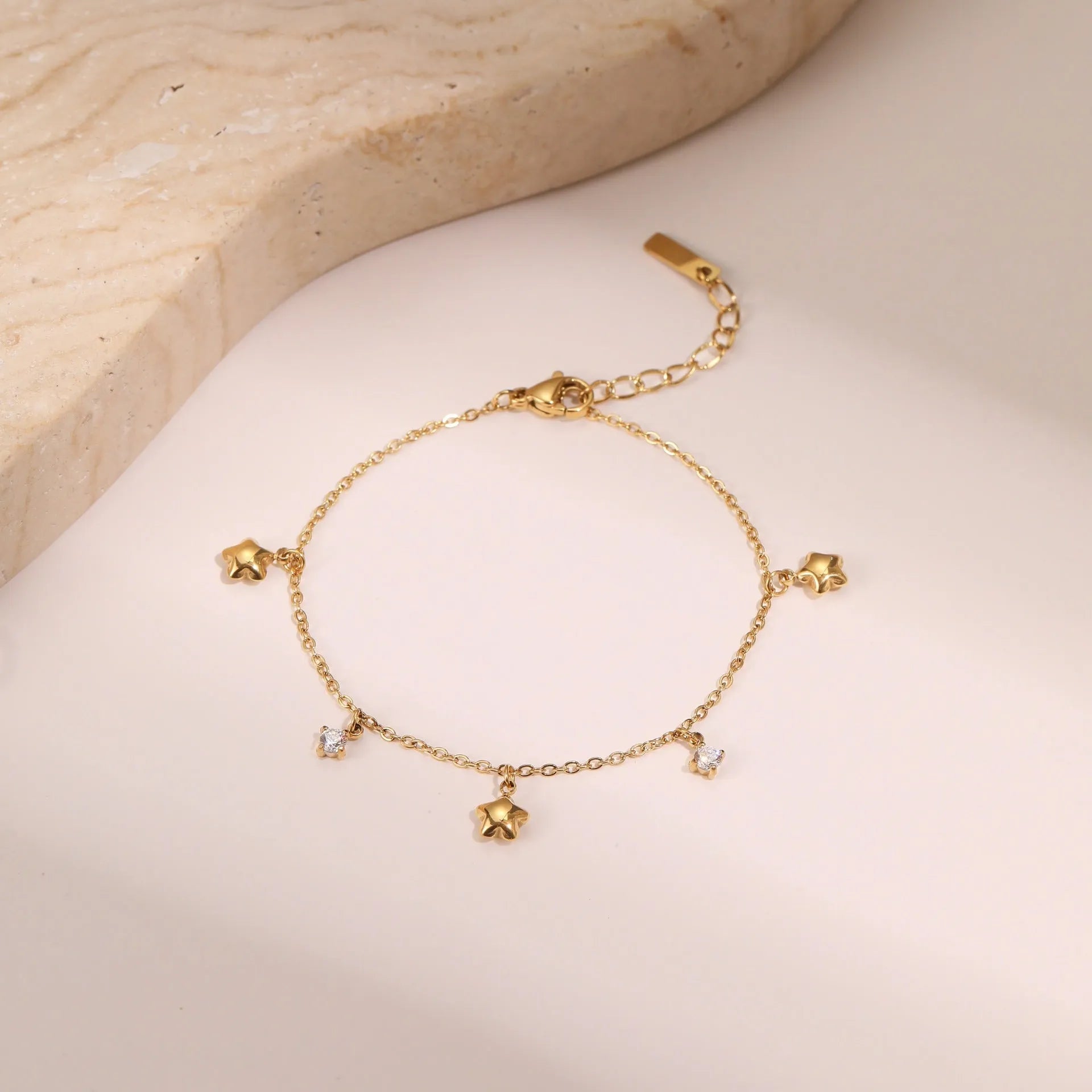 Women's titanium steel bracelet with gold-plated hexagonal star pendant set with zircon stone.