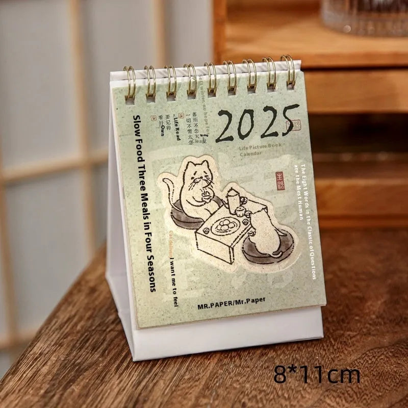 Mini A5 desk calendar 2025 showing one of eight themed designs in simple modern style