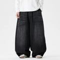 Men's plus-size baggy jeans in light blue denim with straight legs and low waist.