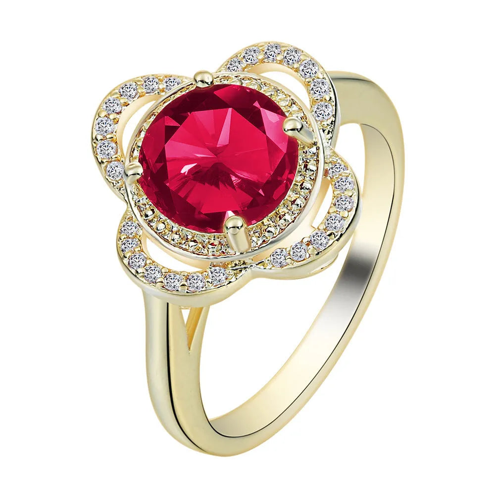 Copper fruit-shaped ring with zircon inlay in electroplated 10-6-1395 colour on a finger.