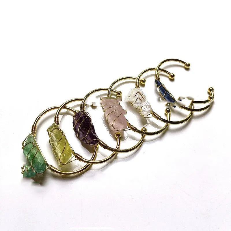 Natural rough crystal stone bracelet with geometric gold tone metal winding, bohemian style.