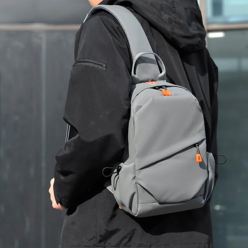 Men's black polyester crossbody bag with adjustable strap and simple casual styling