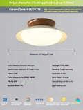 Modern minimalist flying saucer design ceiling lamp in cream yellow on a white ceiling.