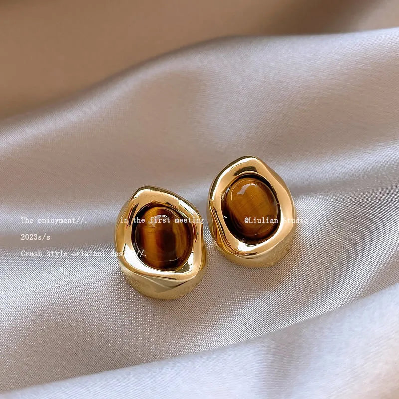 Three pairs of handmade geometric women's earrings with electroplated finishes and tassel details