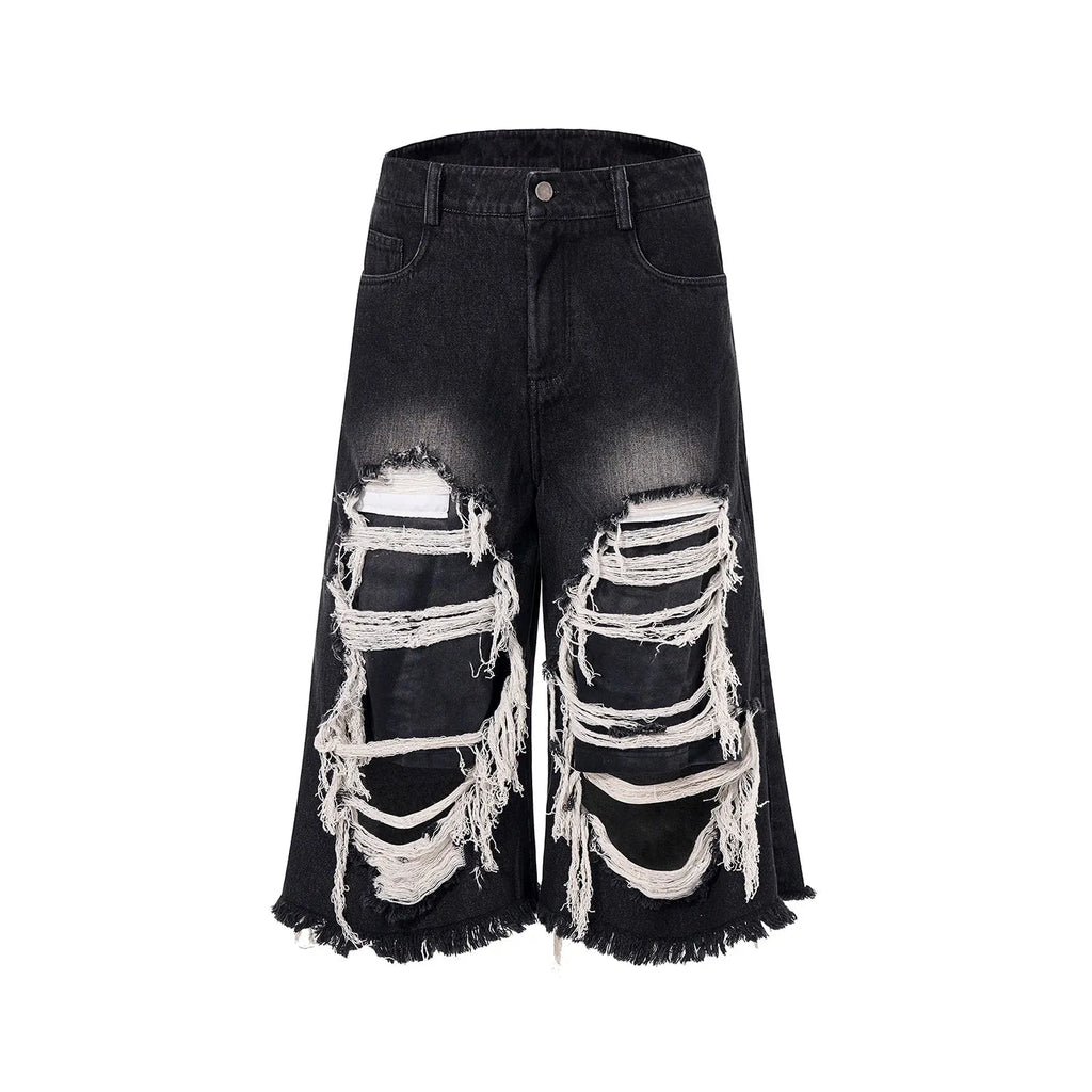 Black women's cropped wide-leg jeans with a mid-high waist and ripped patch distressing.