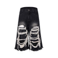 Black women's cropped wide-leg jeans with a mid-high waist and ripped patch distressing.