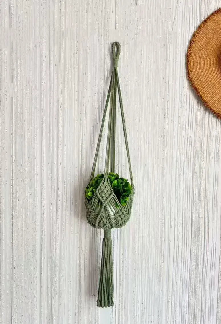 Hand-woven brown polyester cotton flower pot cover with a net pocket on the side.