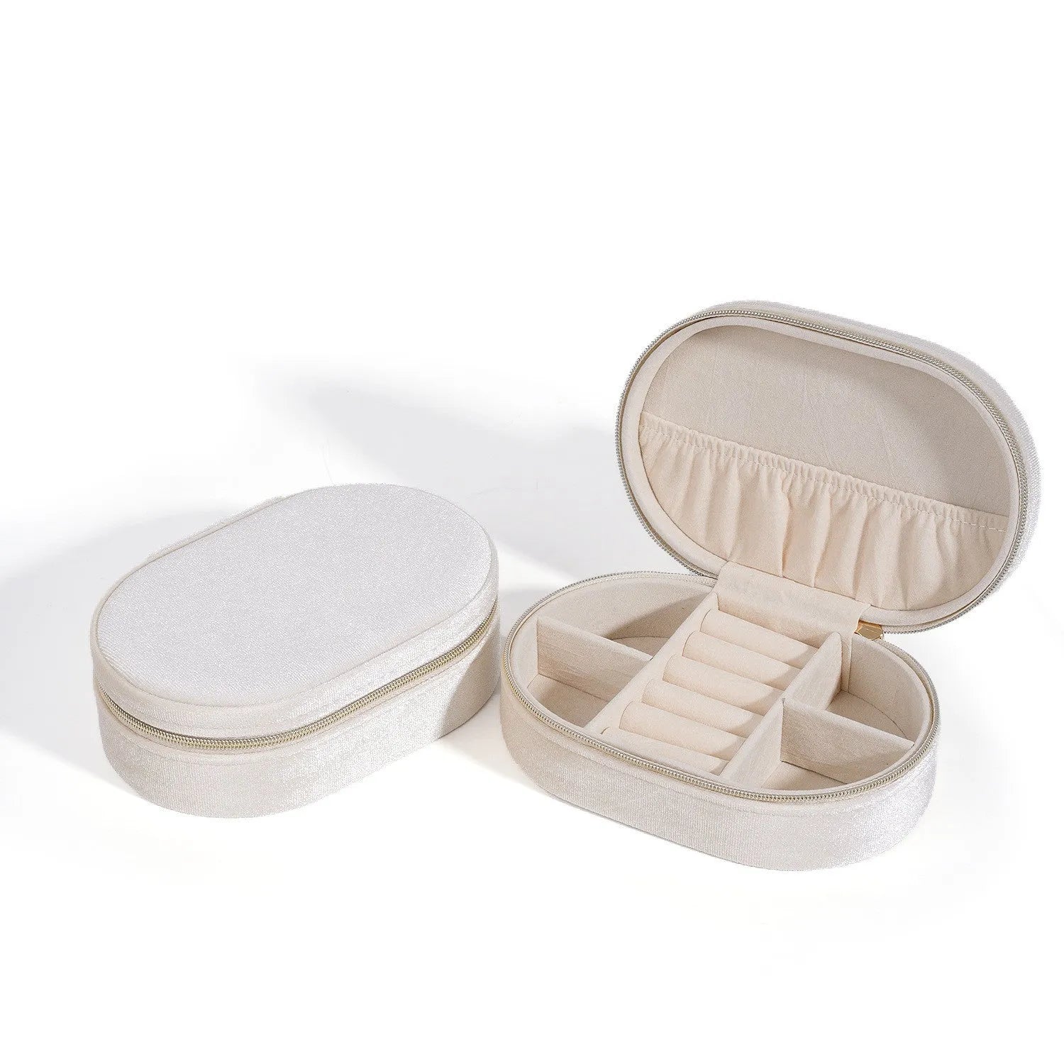 Oval velvet jewellery storage box in lake blue colour showing flannel interior and compact 15x10x5cm dimensions