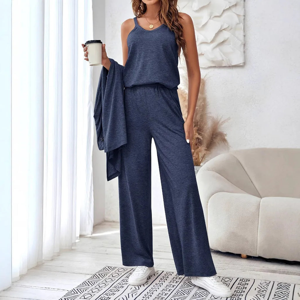 Blue women's three-piece suit featuring cardigan trousers, a long-sleeve top, and suspenders on a hanger.