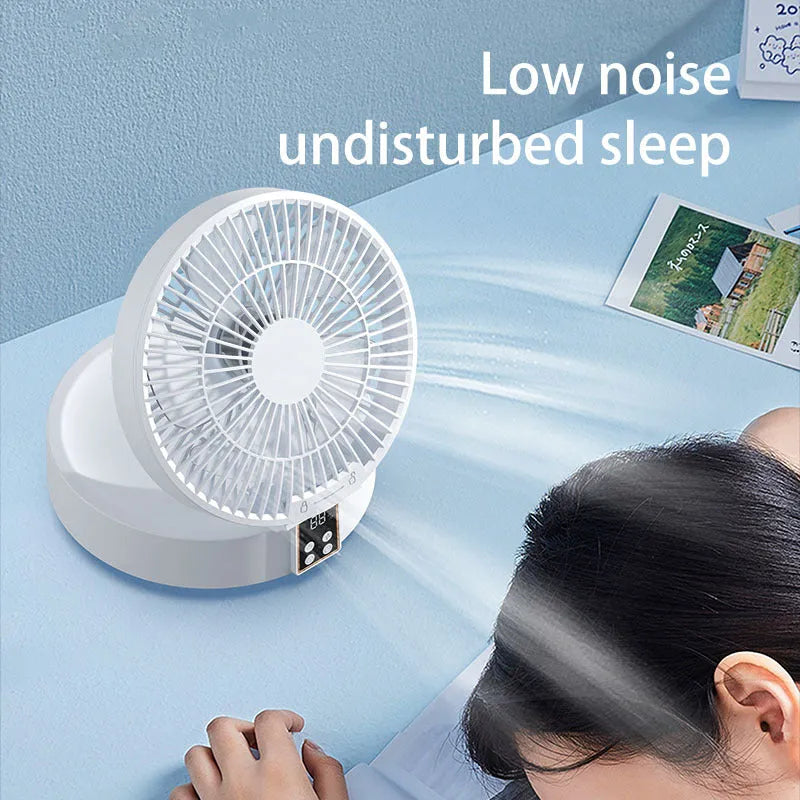 White USB rechargeable folding fan with remote control on a desk, showing 90° adjustable head and night light