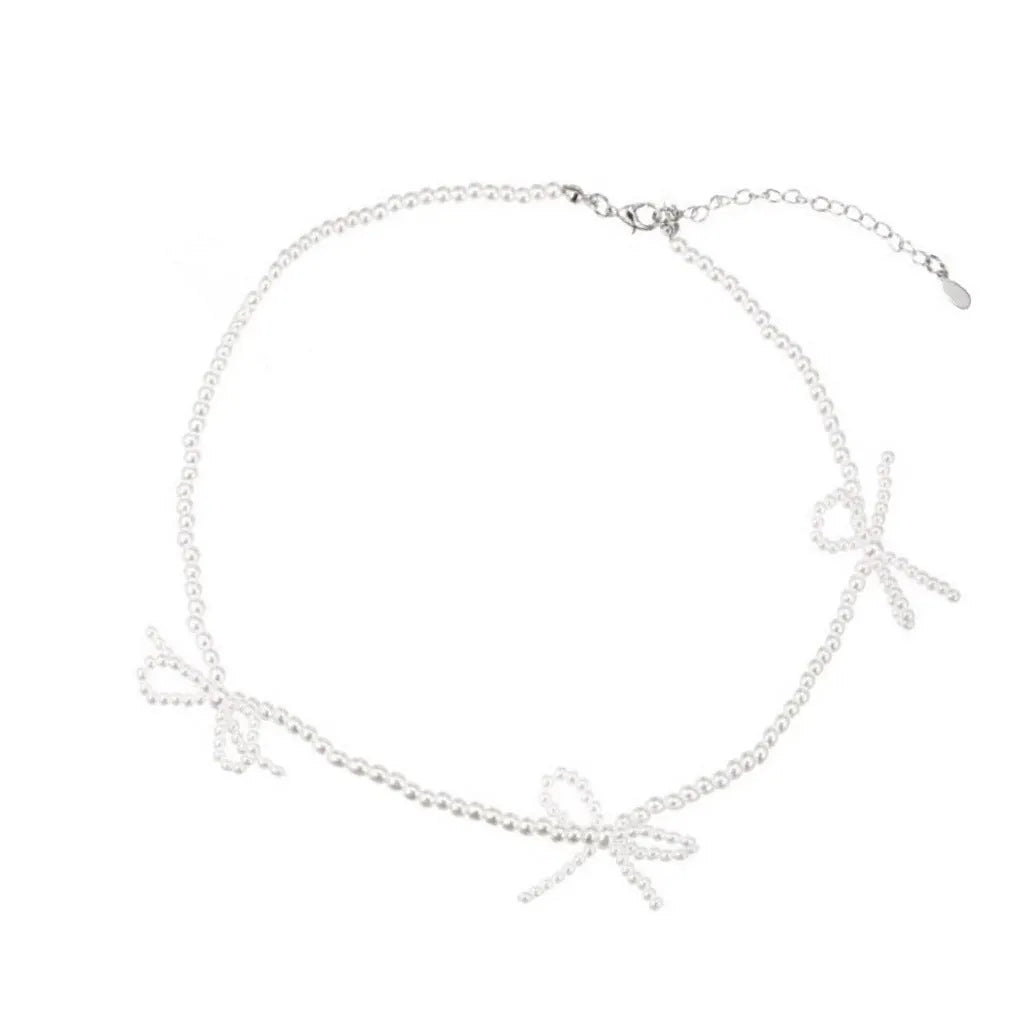 Sweet bow pearl necklace with geometric charm on adjustable 31-40cm chain