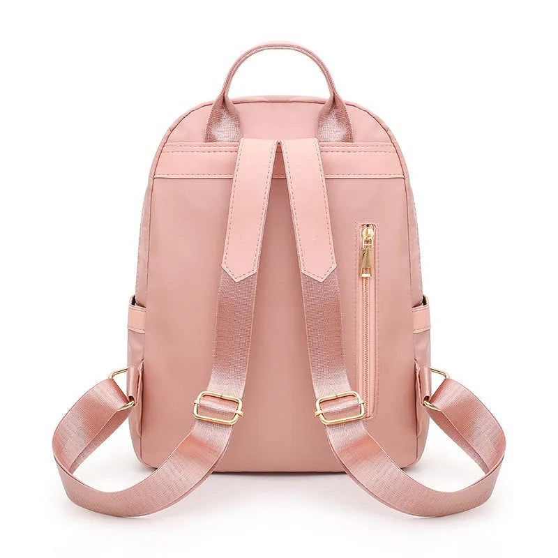 Women's black nylon casual backpack with waterproof construction and anti-theft compartments