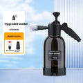 Black hand-held sprayer bottle with ergonomic handle and two nozzles for garden watering and car washing