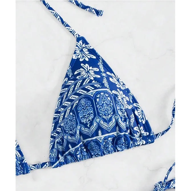 Women's green bandage style bikini swimsuit with split stitching detail on polyester fabric.