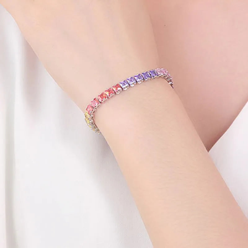 Electroplated real platinum women's bracelet with square diamond geometric design and gang drill details.