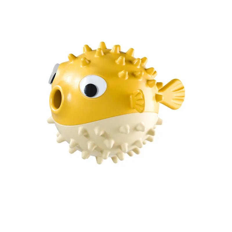 Green fish-shaped dog chew toy with treat dispensing hole and textured surface