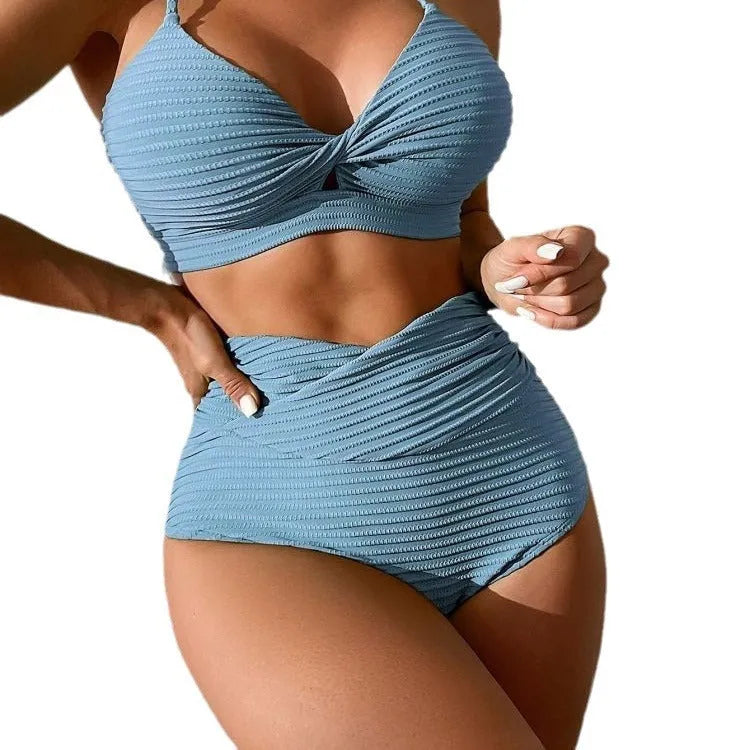Women's solid colour polyester two-piece bikini swimsuit shown in blue.
